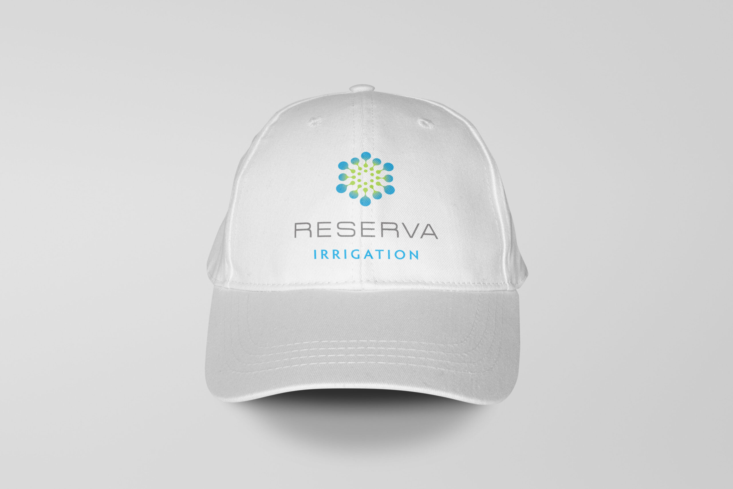 White baseball cap with the Reserva logo on it.